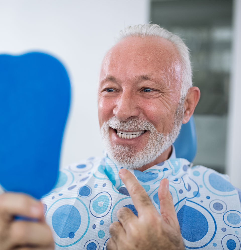 dental implants patient smiling after procedure