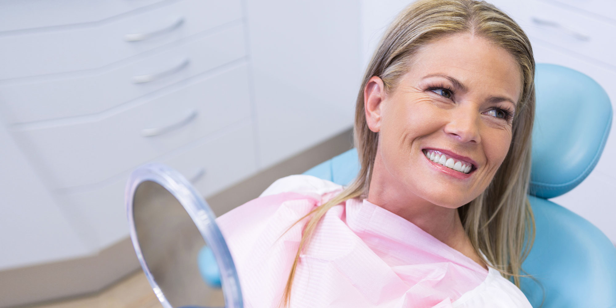 dental-patient-smiling-after-porcelain-bridge-procedure