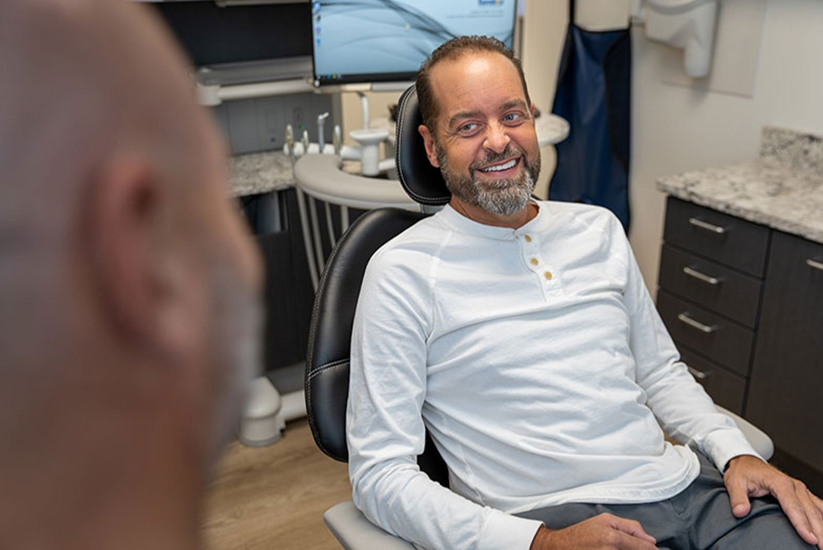 patient listening to doctor as they go over dental procedure