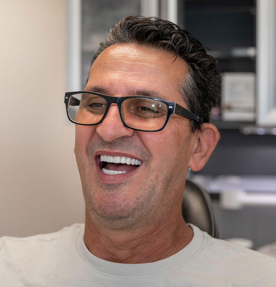 patient smiling brightly after their dental procedure